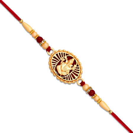 Traditional Ganesha Rakhi With Golden Finish And Sacred Red Thread