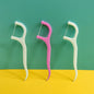Convenient floss sticks for maintaining oral hygiene.