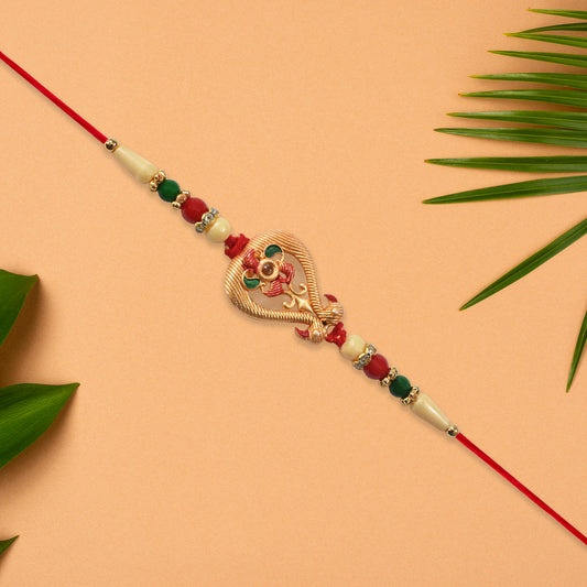 Designer Rakhi With Veena And Flower Charm